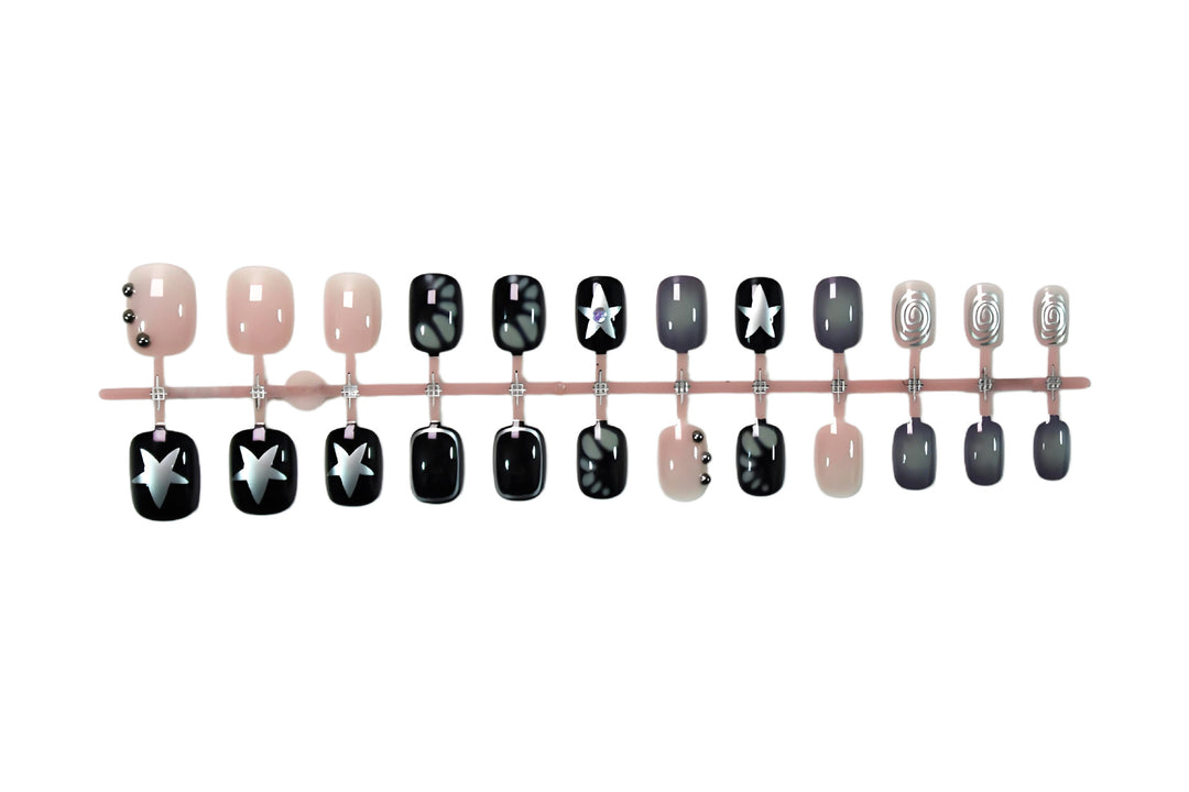 Kunstnagelset mit kreativen Sternen- und Glitzerdesigns Karnz