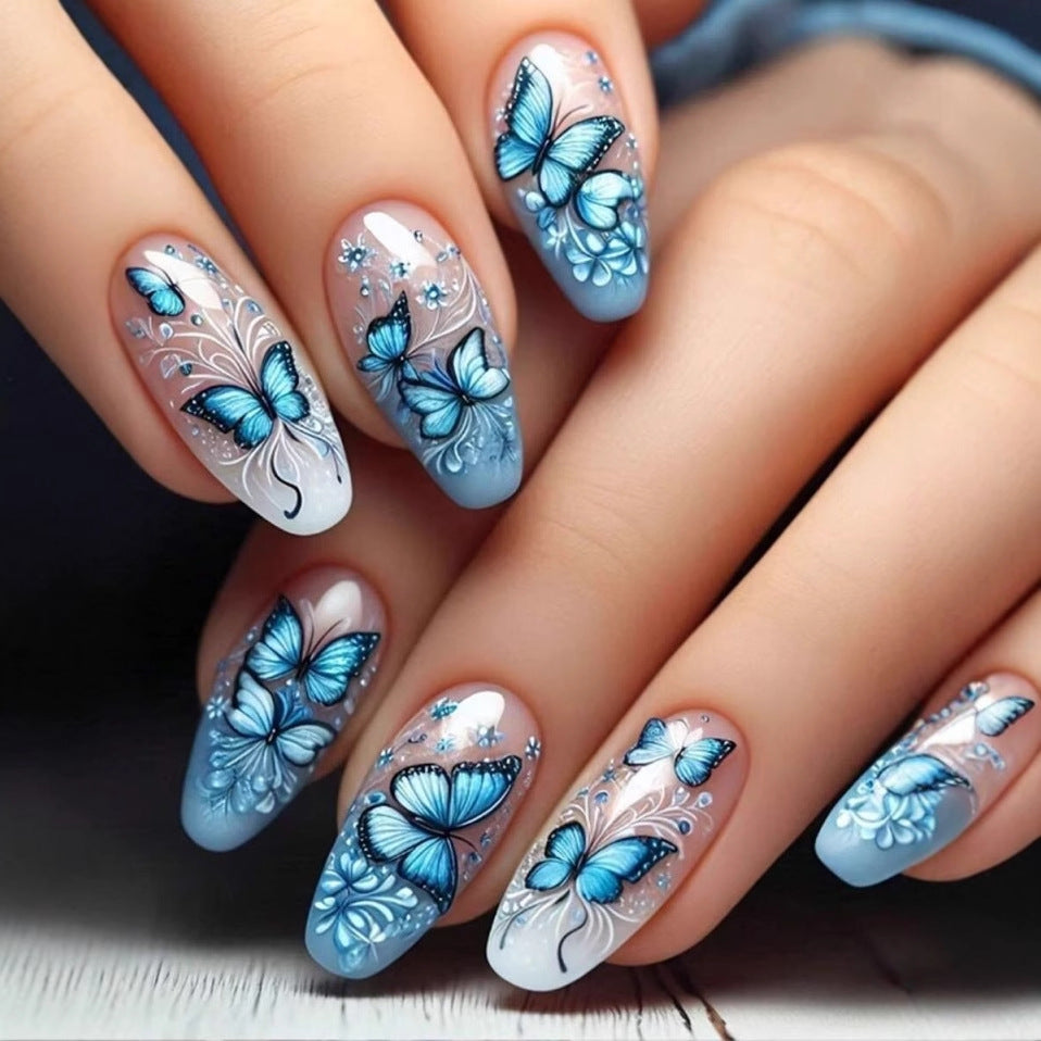 Kunstnagelset mit filigranen Schmetterlings- und Blütenmotiven Karnz