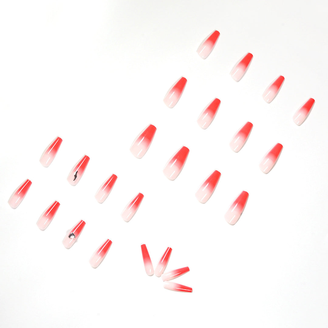 Kunstvolle Stiletto-Nägel mit elegantem Farbverlauf und Strassverzierung Karnz