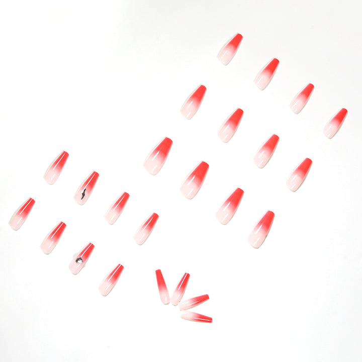 Kunstvolle Stiletto-Nägel mit elegantem Farbverlauf und Strassverzierung Karnz