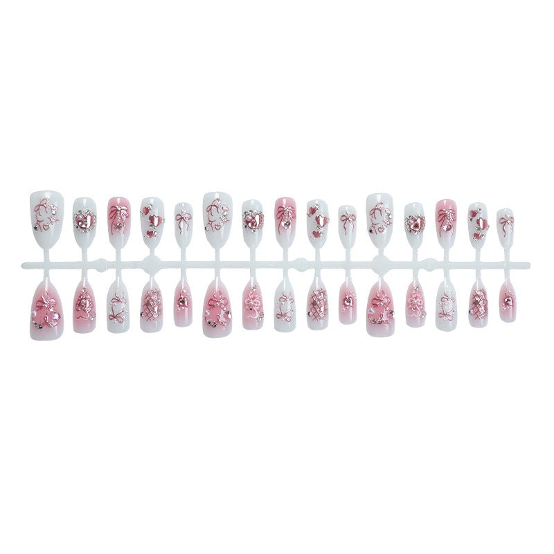 Elegantes Kunstnagelset mit floralen und Glitzerdetails Karnz