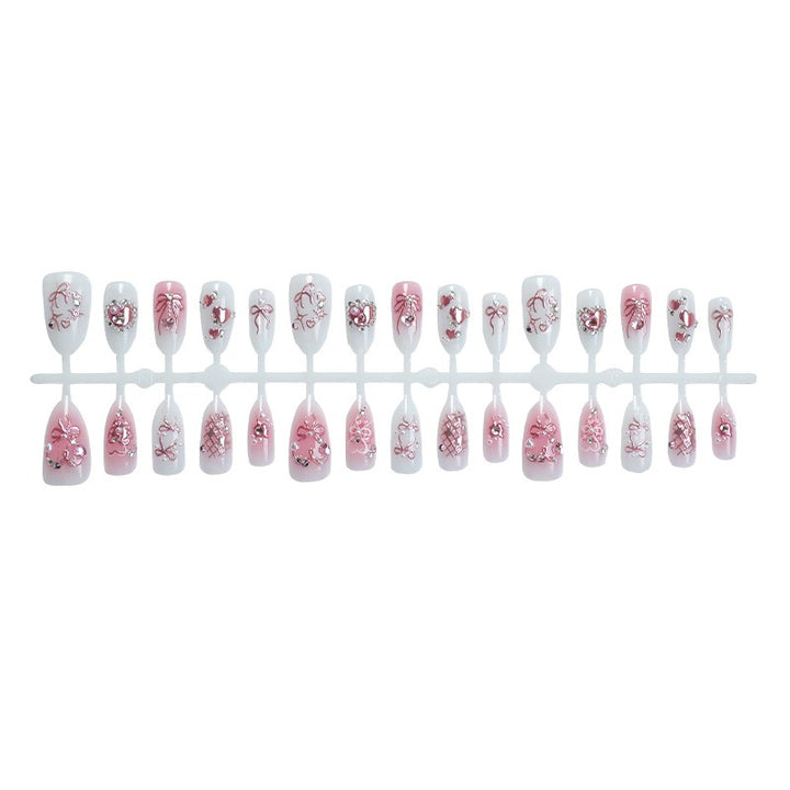 Elegantes Kunstnagelset mit floralen und Glitzerdetails Karnz