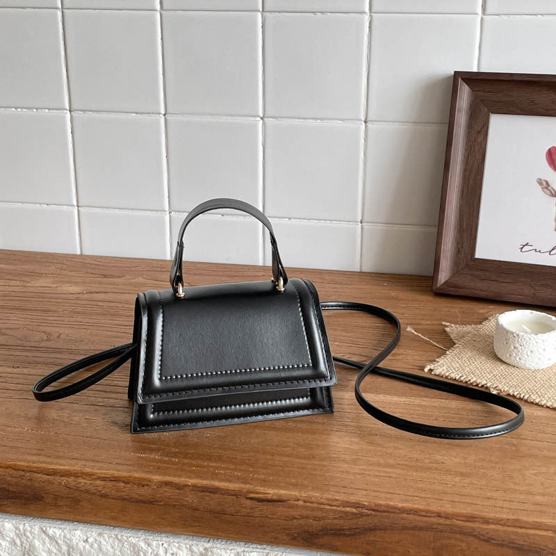 Strukturierte Mini-Crossbody-Handtasche