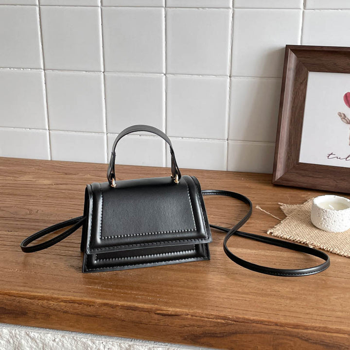 Strukturierte Mini-Crossbody-Handtasche