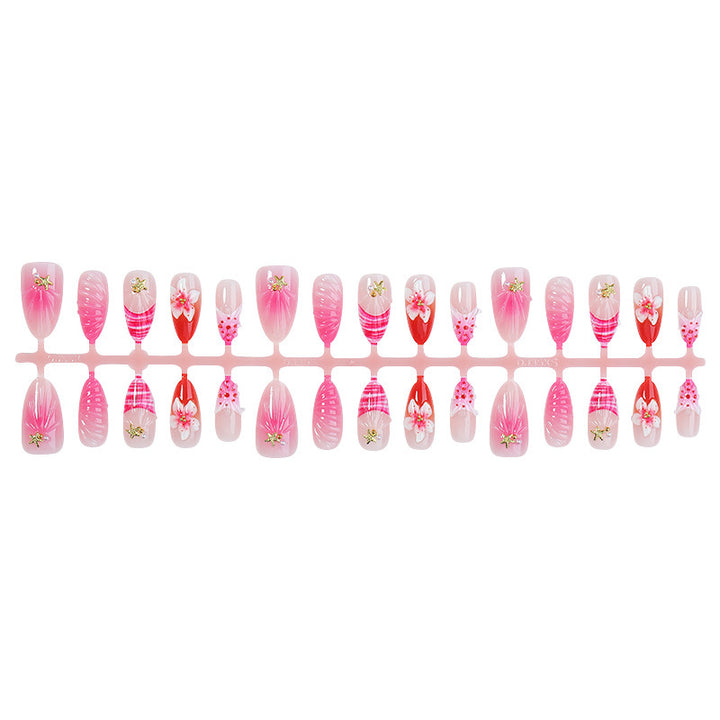 Kunstnagelset mit blühenden 3D-Details und Glitzerakzenten Karnz
