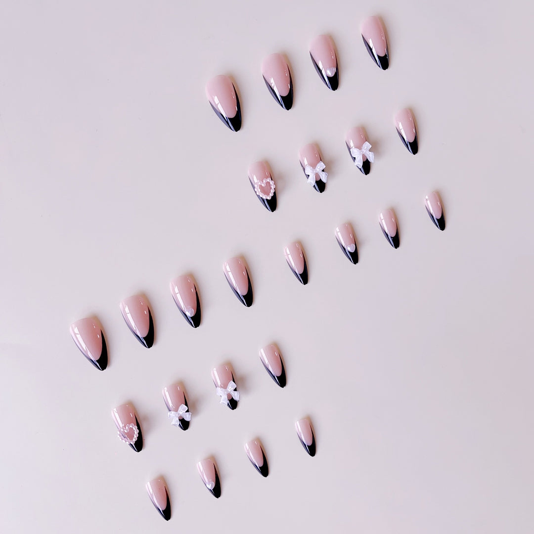 Glamouröse Kunstnagelspitzen mit 3D Schleifen und Herzverzierungen Karnz