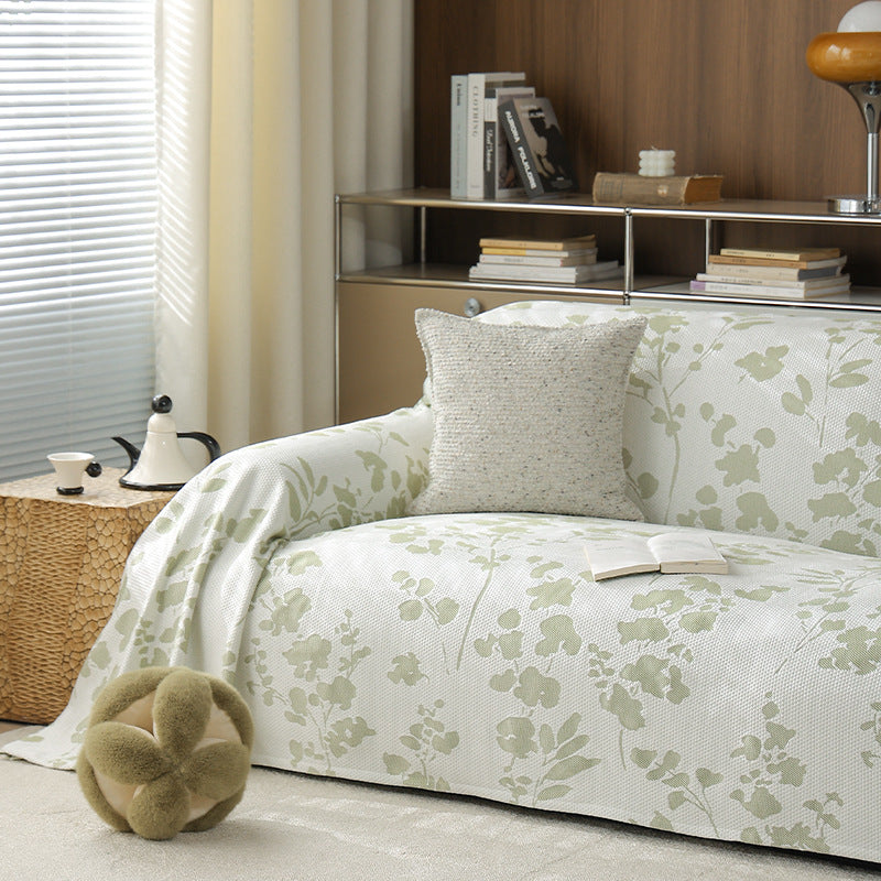 Elastischer Sofa‑Schonbezug mit floraler Reliefstruktur und universeller Passform