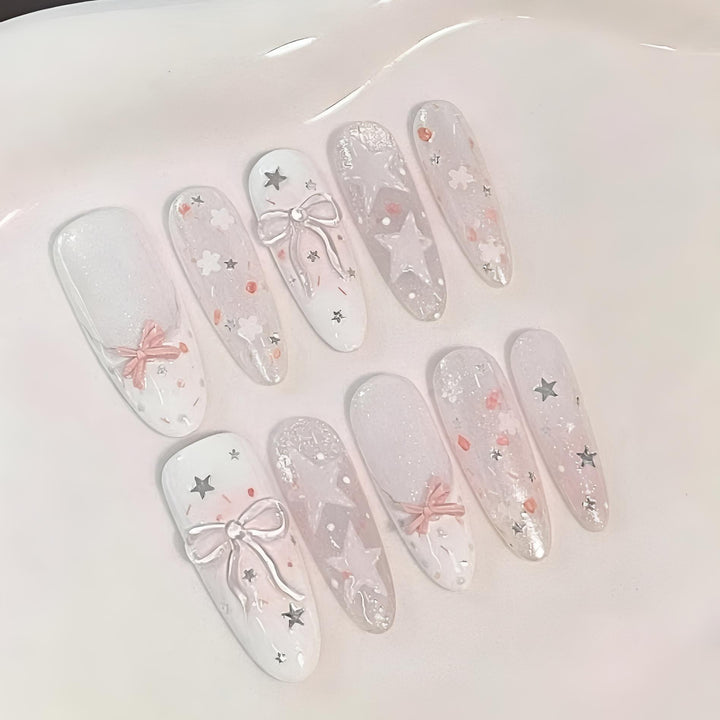 Dekorative Press-On Nagelkunst Set mit Sternen und Schleifen
