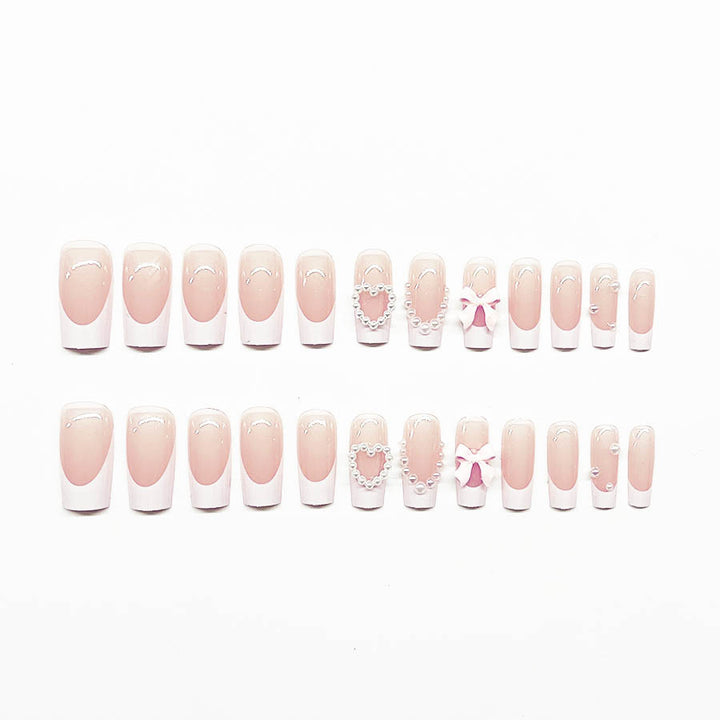 Kunstnagelset mit eleganten 3D-Blüten und Perlverzierungen Karnz