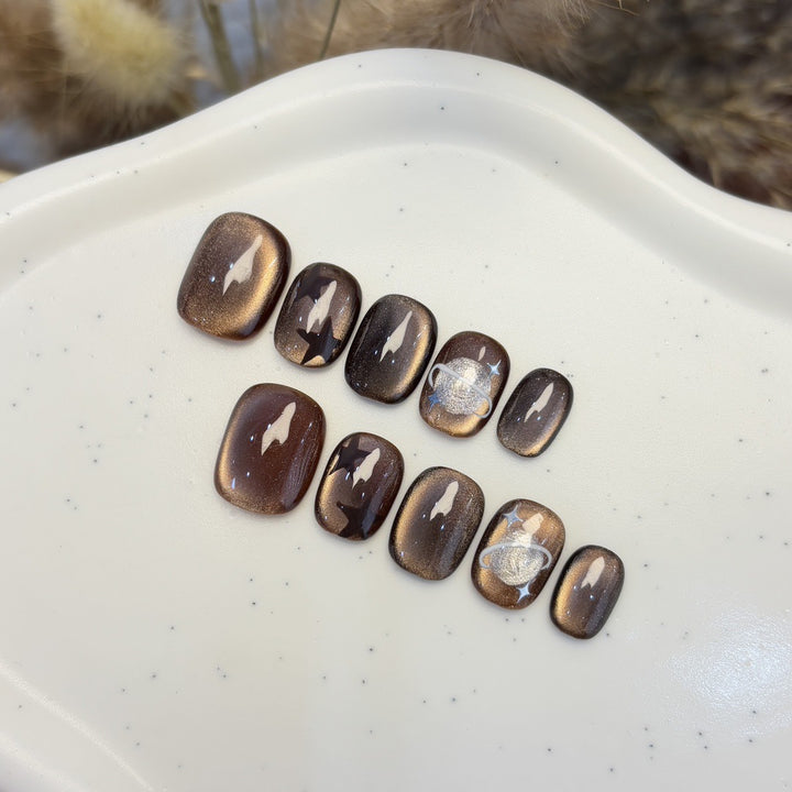 Kunstnagelset mit Sternen- und Planetendesign Karnz