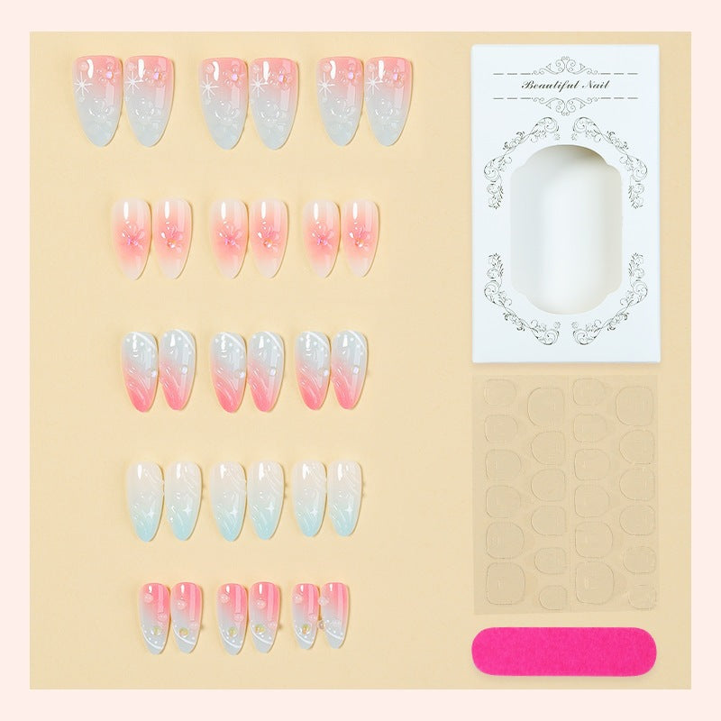Kunstnagelset mit elegantem Farbverlauf und floralem Design Karnz