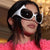 Damen futuristische Sonnenbrille mit stylischem Design und schützendem UV-Filter Karnz