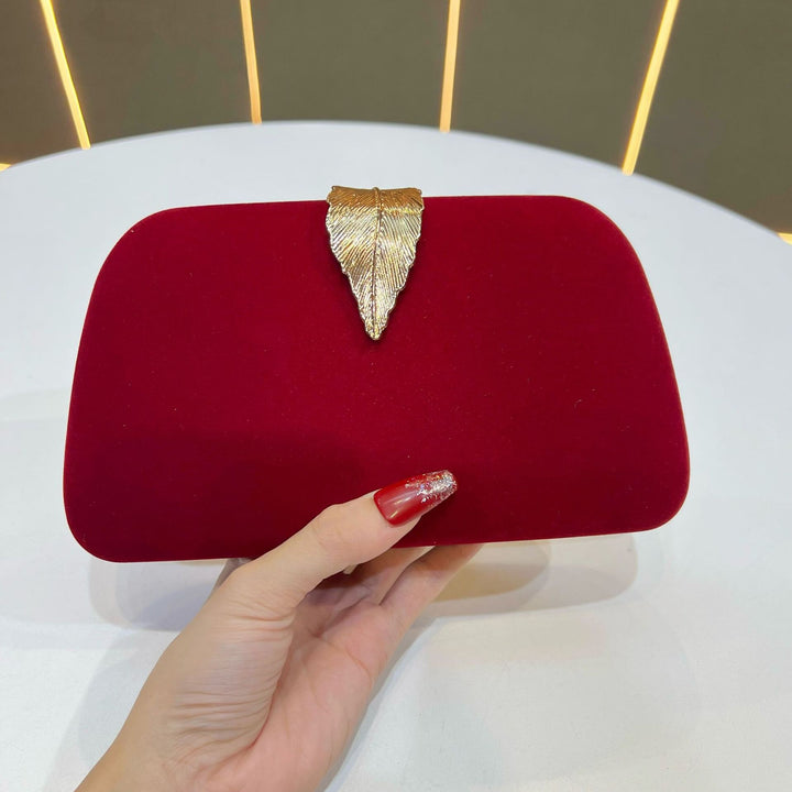 Elegante abendhandtas mit Blattakzenten