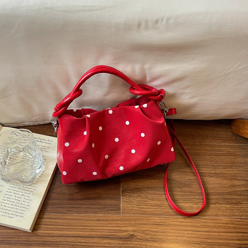 Verspielt gepunktete Handtasche