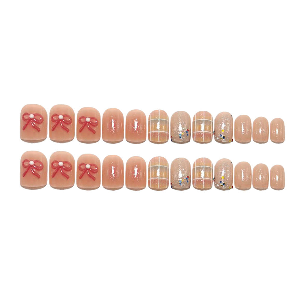 Kreatives Kunstnagelset mit Glitzer und Blumenapplikationen Karnz