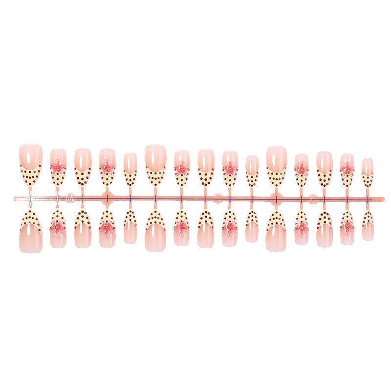 Kunstnagelset mit floralem Design und eleganten Punkten Karnz