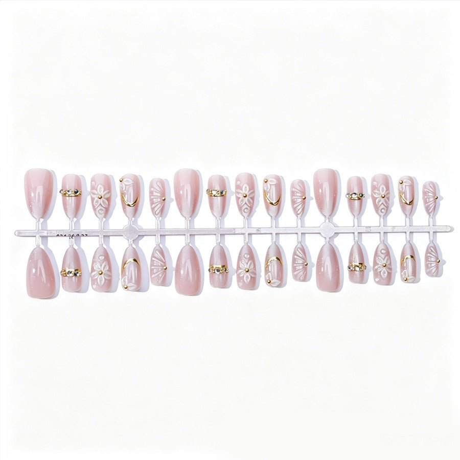 Elegantes Kunstnagelset mit Blumen- und Glitzerelementen Karnz