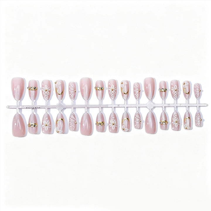 Elegantes Kunstnagelset mit Blumen- und Glitzerelementen Karnz