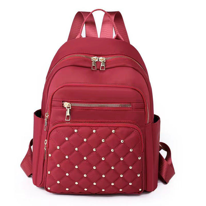 Quilted Rucksack mit dekorativen Nieten Karnz