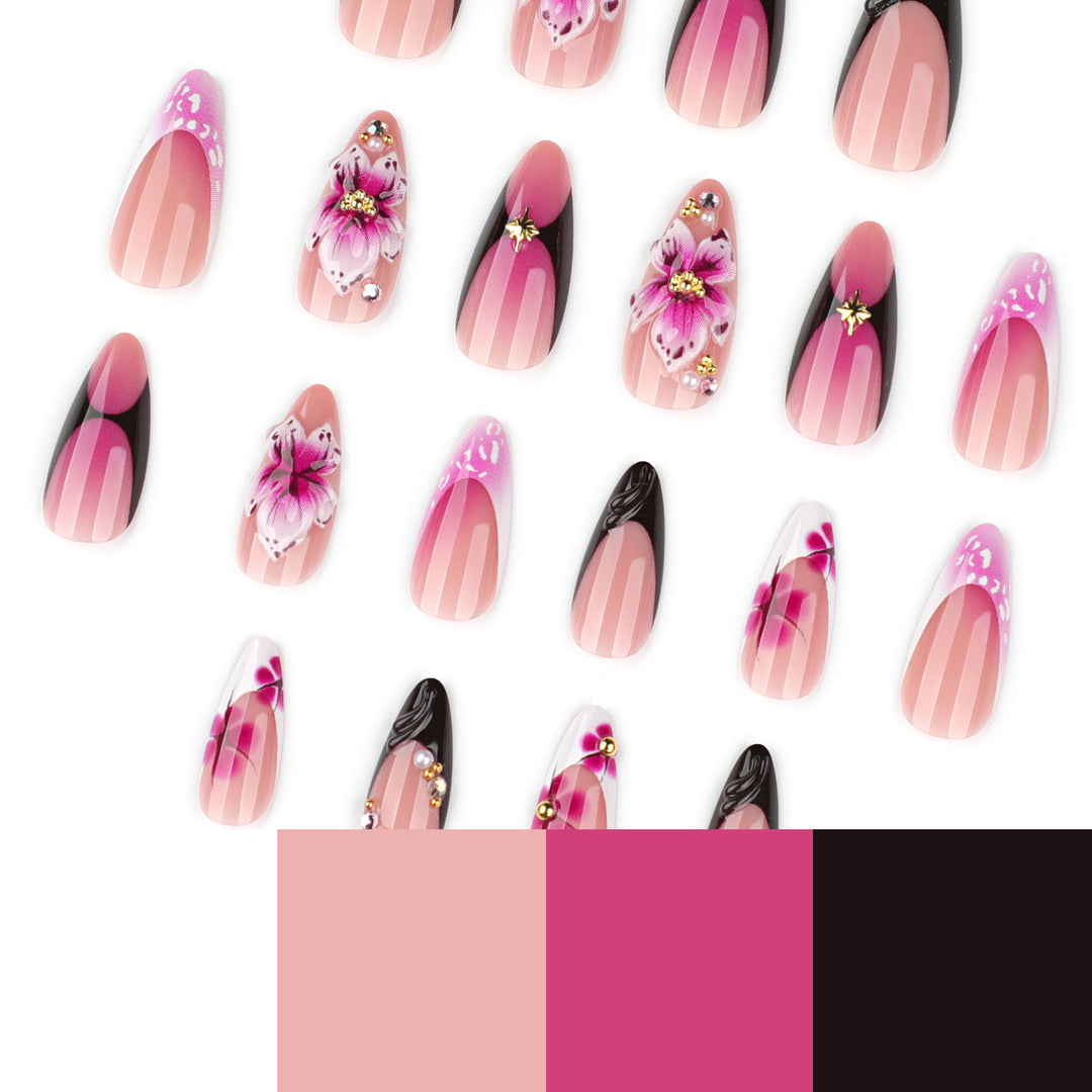 Kunstvolle Stiletto-Nägel mit blühendem Design und Glitzerakzenten Karnz