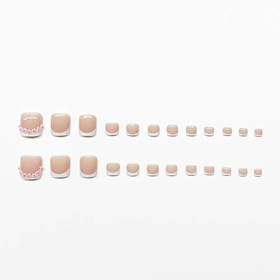 Fußnagelkunstset mit elegantem French Design und Glamourösen Strassakzenten Karnz