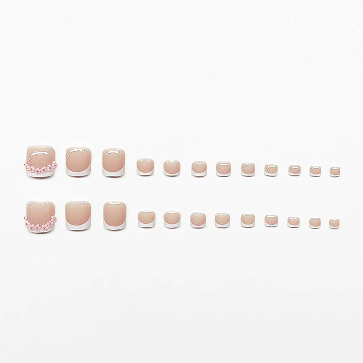 Fußnagelkunstset mit elegantem French Design und Glamourösen Strassakzenten Karnz
