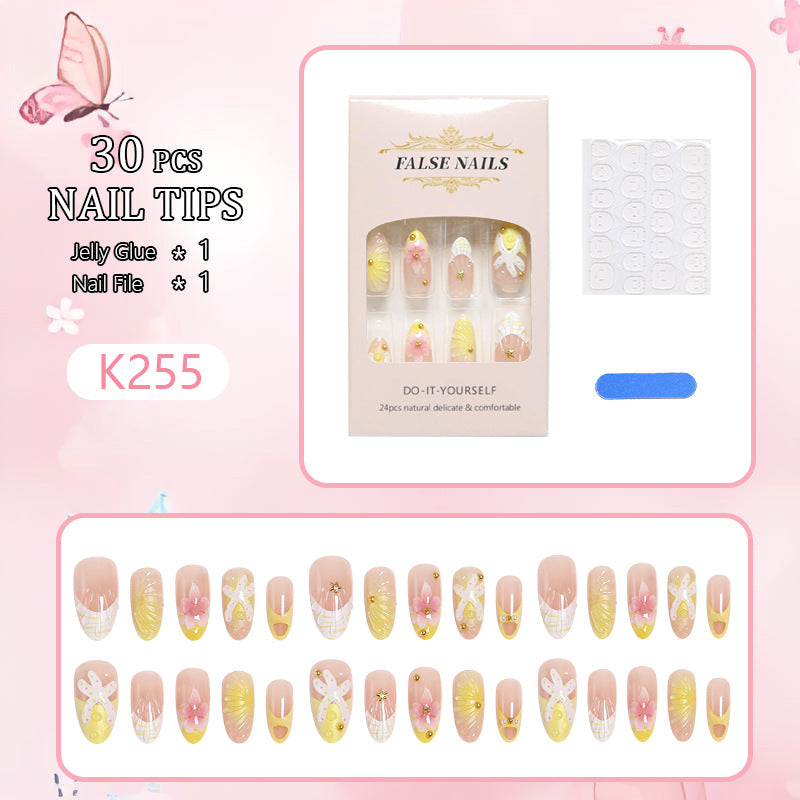 Kunstnägel mit floralem Glitzermuster Karnz