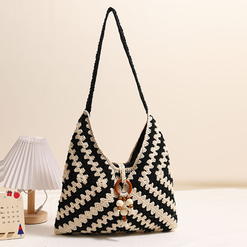 Damen Handtasche mit kunstvollem Flechtmuster Karnz