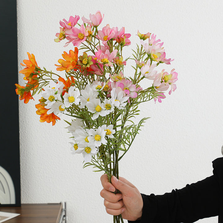 Künstlicher Blütenzweig mit leuchtenden pinken Blumen Karnz