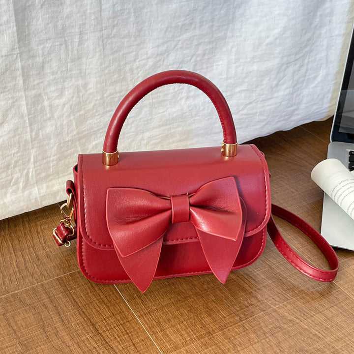 Schultertasche mit Schleifenakzent