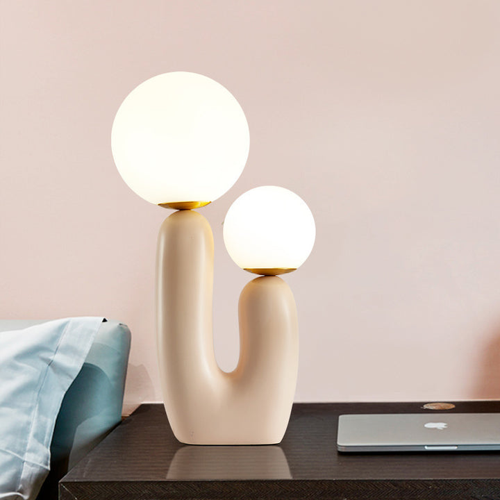 Künstlerische Tischlampe mit dualem Globusdesign