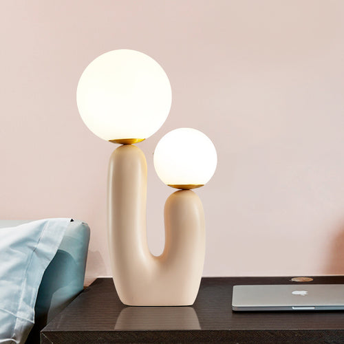 Künstlerische Tischlampe mit dualem Globusdesign