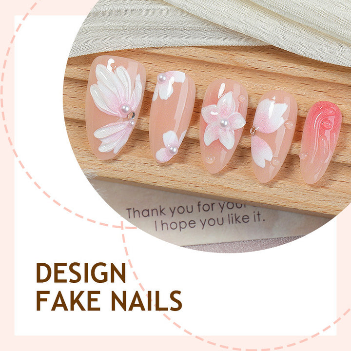 Kunstnagelset mit floralen Motiven und Strassverzierungen Karnz