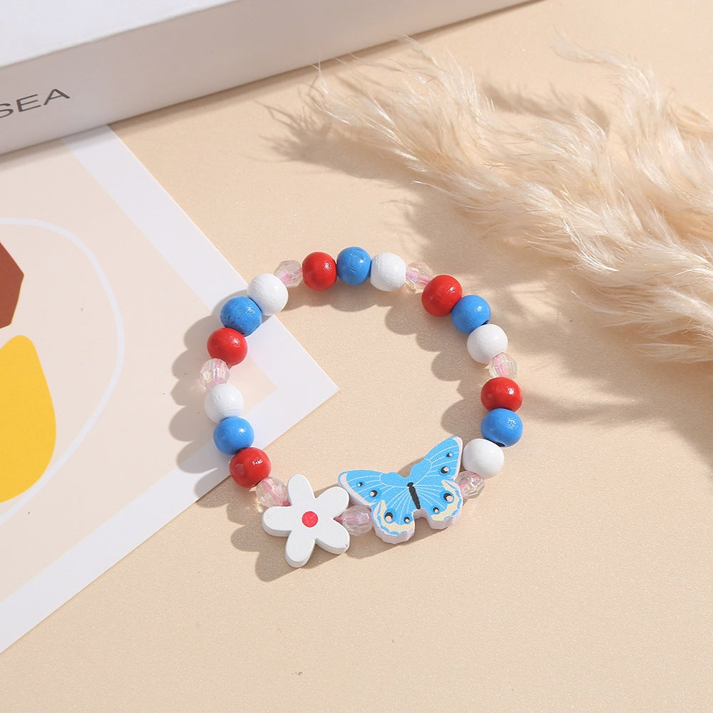 Verspieltes Armband mit Herz- und Schmetterlings-Anhängern Karnz