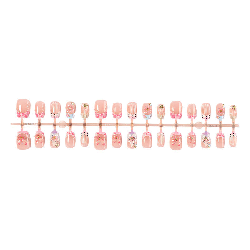 Kunstnagelset mit floralen Designs und eleganten Glitzerelementen Karnz