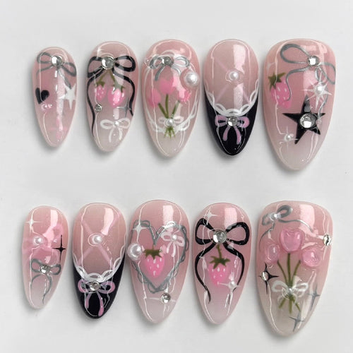 Kreatives Kunstnagelset mit eleganten Schleifen- und Glitzermotiven Karnz