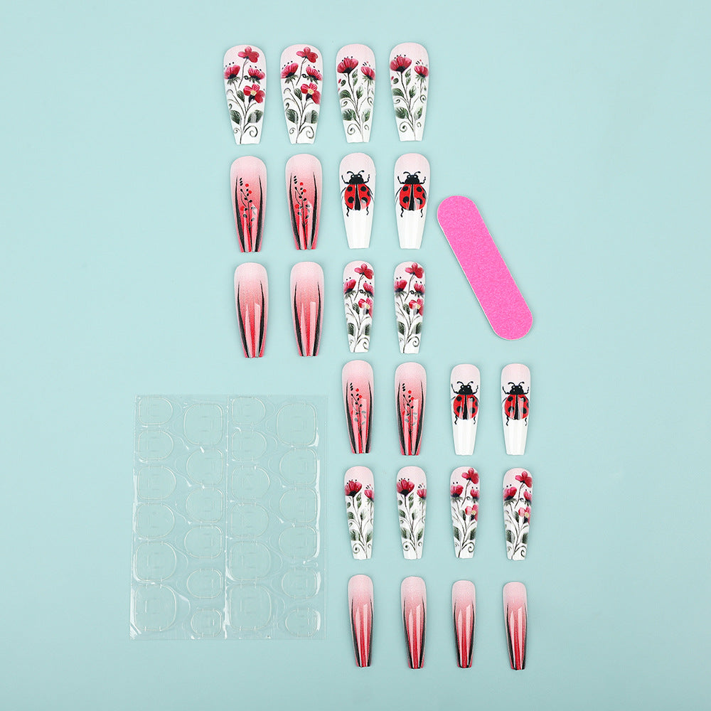 Kreatives Kunstnagelset mit floralen Motiven Karnz