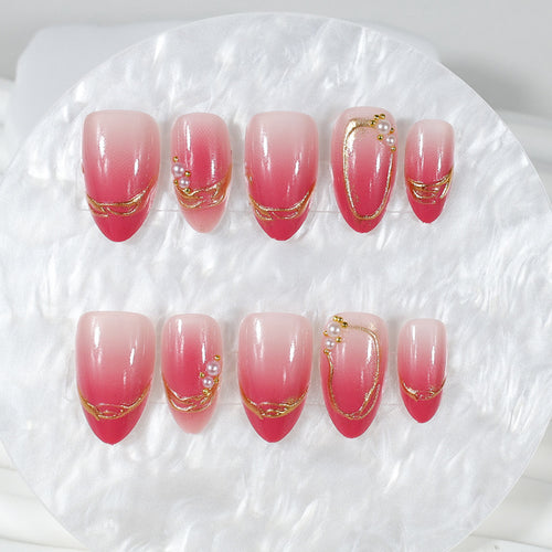 Kunstnagelset mit eleganten Ombré-Designs und Glitzerakzenten Karnz