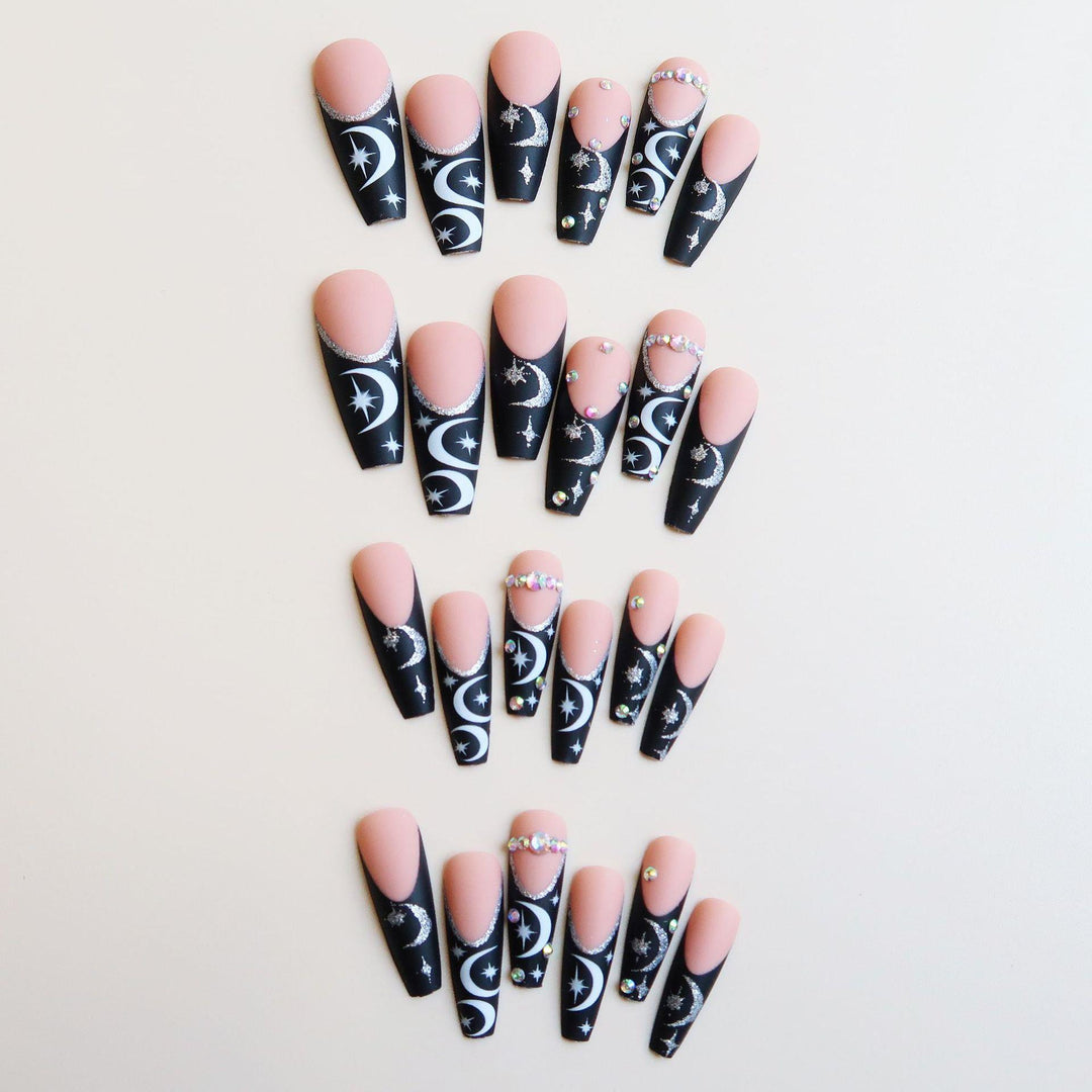 Künstlerisches langes Stiletto Press-On Nagelset mit Mond- und Sternmustern