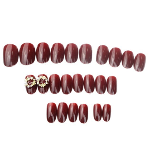 Glänzendes rotes Press-On-Nagelset mit eleganten Perlenakzenten Karnz