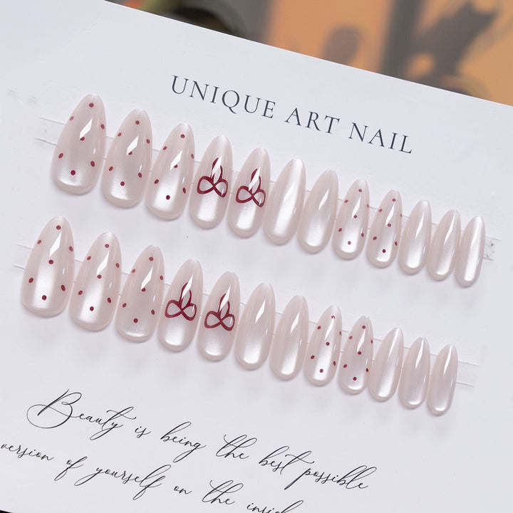 Elegante Stiletto Press-On-Nail-Art mit minimalistischen Schleifen-Design