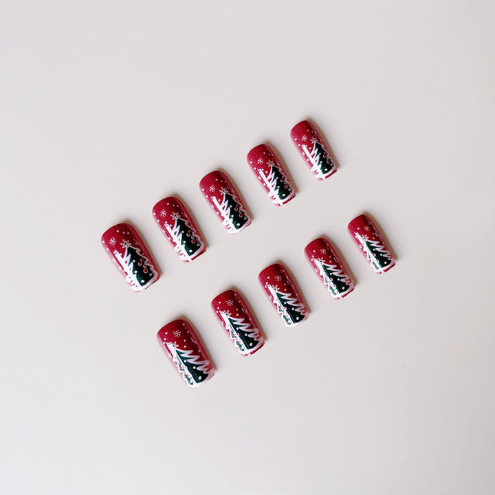 Kunstnagelset mit festlicher Weihnachtsmotiven und Glitzerakzenten Karnz
