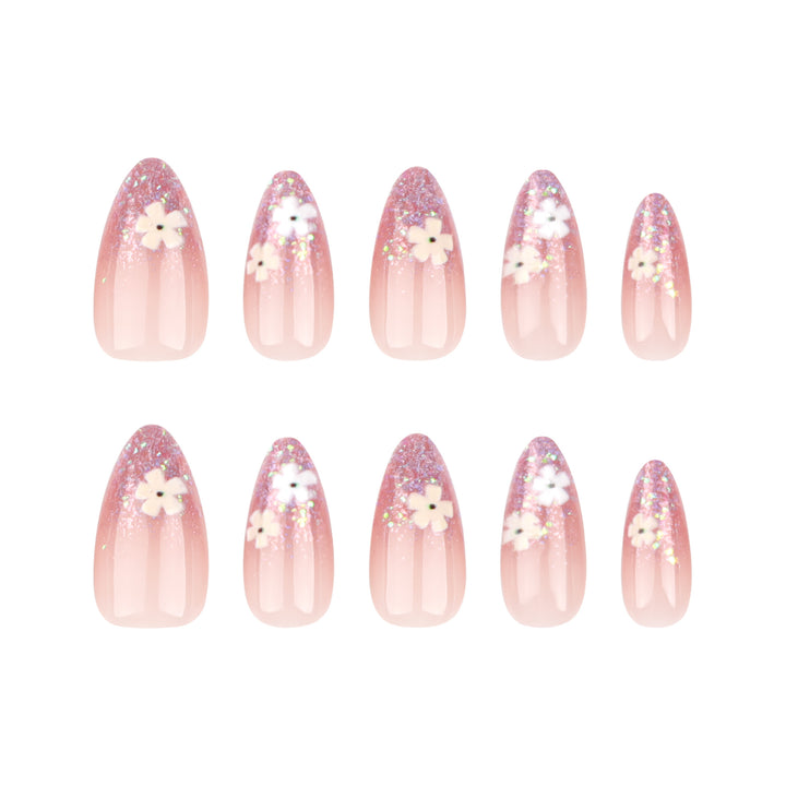 Glamouröse Nagelverlängerungen mit glitzerndem und floralem Design Karnz