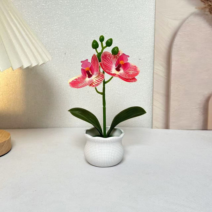 Elegante künstliche Orchideenpflanzenanordnung für die Wohnkultur-Darstellung