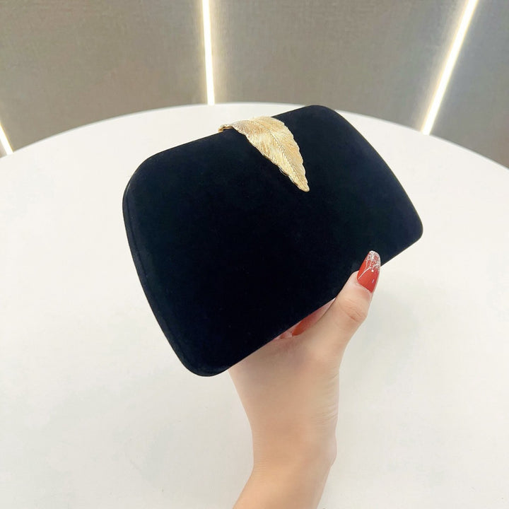 Elegante abendhandtas mit Blattakzenten