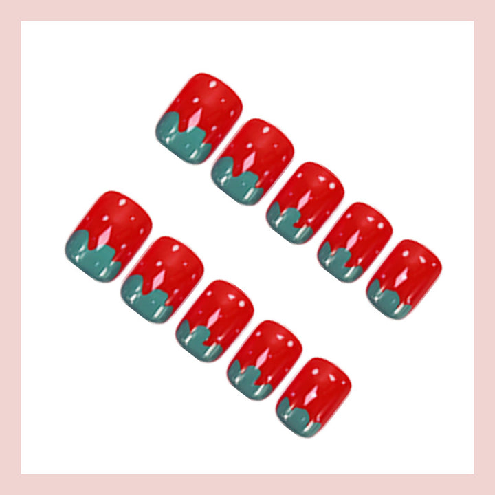 Kunstnagelset mit fröhlichen Erdbeerdesigns Karnz