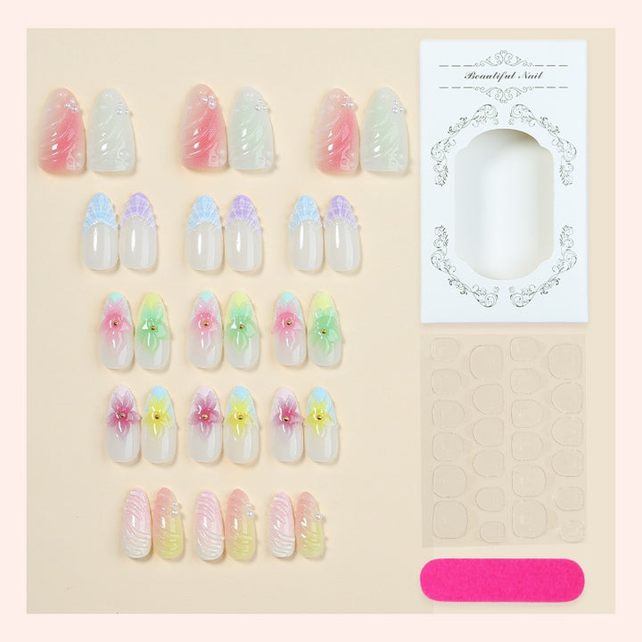 Kunstnagelset mit bunten floralem Design und Glitzerakzenten Karnz