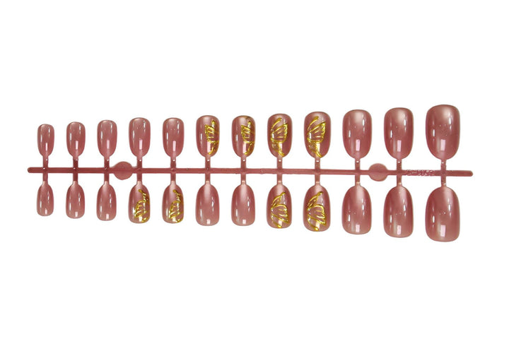 Kunstnagelset mit eleganten goldenen Akzenten und schimmerndem Finish Karnz