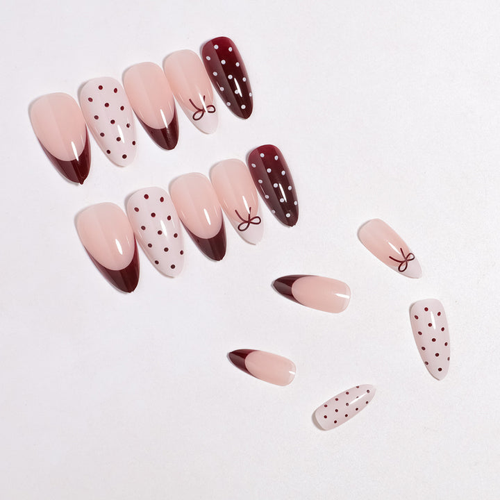 Künstlerisches Press-On-Nagelset mit Schleifen- und Punktdesign Karnz
