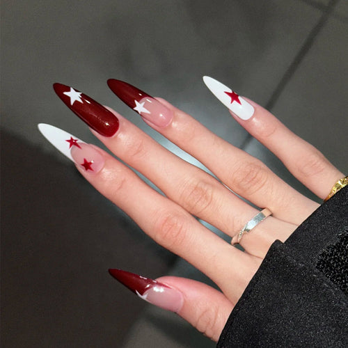 Künstlerische mit Sternen verzierte Stiletto Press-On Nägel Karnz